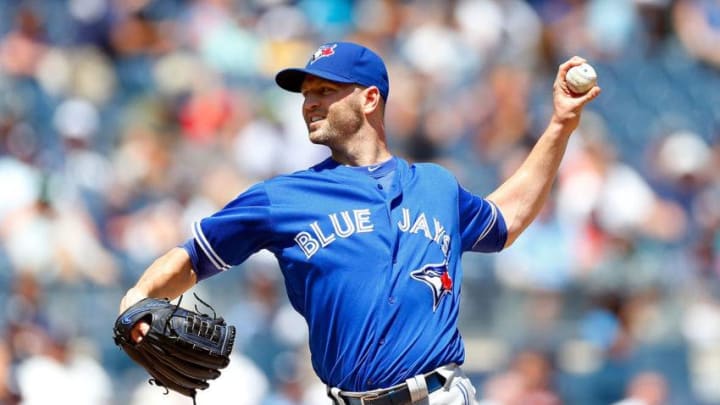NEW YORK, NY - AUGUST 17: J.A. Happ #33 of the Toronto Blue Jays pitches in the first inning against the New York Yankees at Yankee Stadium on August 17, 2016 in the Bronx borough of New York City. (Photo by Jim McIsaac/Getty Images)