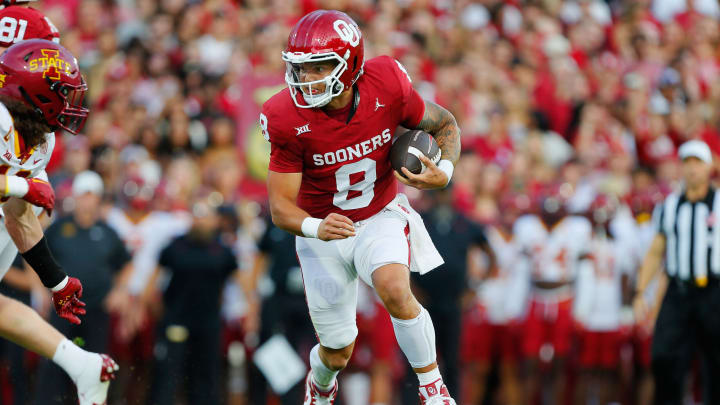 NORMAN, OKLAHOMA – SEPTEMBER 30: Quarterback Dillon Gabriel #8 of the Oklahoma Sooners gears up to take a hit on his way to the end zone for a one-yard touchdown against the Iowa State Cyclones in the first quarter at Gaylord Family Oklahoma Memorial Stadium on September 30, 2023 in Norman, Oklahoma. Oklahoma won 50-20. (Photo by Brian Bahr/Getty Images)