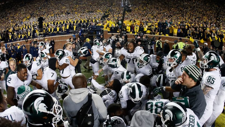 ANN ARBOR, MI – OCTOBER 17: The Michigan State Spartans celebrate in the end zone after defensive back Jalen Watts-Jackson #20 scored the game winning touchdown against the Michigan Wolverines during the final seconds of college football game at Michigan Stadium on October 17, 2015 in Ann Arbor, Michigan. The Spartans defeated the Wolverines 27-23. (Photo by Christian Petersen/Getty Images)