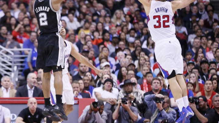 LOS ANGELES, CA – DECEMBER 16: San Antonio Spurs small forward Kawhi Leonard (2) takes a jumpshot over Los Angeles Clippers power forward Blake Griffin (32) during the Los Angeles Clippers 115-92 victory over the San Antonio Spurs at the Staples Center at the Staples Center on December 16, 2013 in Los Angeles, California. NOTE TO USER: User expressly acknowledges and agrees that, by downloading and or using this photograph, User is consenting to the terms and conditions of the Getty Images License Agreement. (Photo by Chris Elise/Getty Images)