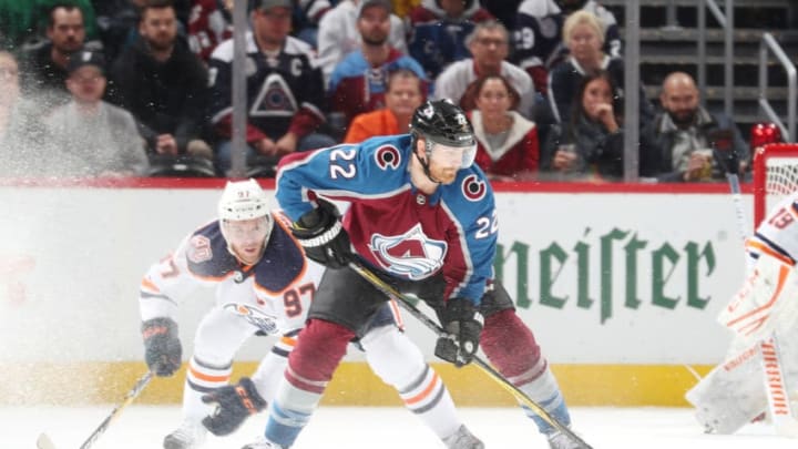 DENVER, CO - APRIL 2: Colin Wilson #22 of the Colorado Avalanche skates against Connor McDavid #97 of the Edmonton Oilers at the Pepsi Center on April 2, 2019 in Denver, Colorado. (Photo by Michael Martin/NHLI via Getty Images)