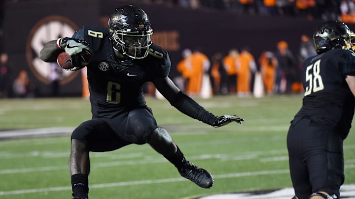 Nov 26, 2016; Nashville, TN, USA; Vanderbilt Commodores receiver Darrius Sims (6) hurdles running back Dallas Rivers (28) during the first half against the Tennessee Volunteers at Vanderbilt Stadium. Mandatory Credit: Christopher Hanewinckel-USA TODAY Sports