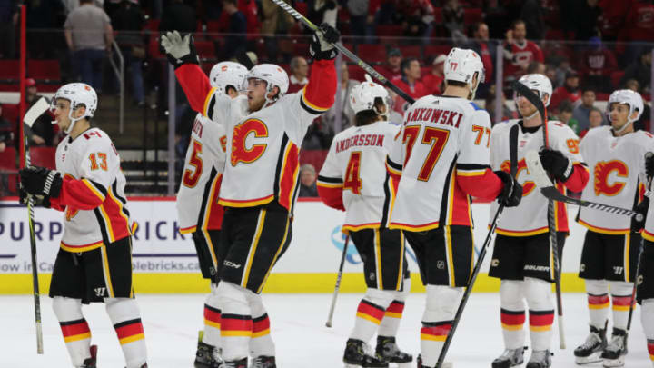 RALEIGH, NC - FEBRUARY 03: Calgary Flames center Elias Lindholm (28) former Carolina Hurricanes player makes fun of the Storm Surge cheer at the end of the 3rd period of the Carolina Hurricanes game versus the Calgary Flames on February 3rd, 2019 at PNC Arena in Raleigh, NC. (Photo by Jaylynn Nash/Icon Sportswire via Getty Images)