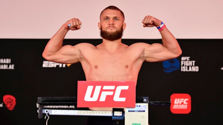 ABU DHABI, UNITED ARAB EMIRATES - JULY 17: In this handout image provided by UFC, Rafael Fiziev of Kazakhstan poses on the scale during the UFC Fight Night weigh-in inside Flash Forum on UFC Fight Island on July 17, 2020 in Yas Island, Abu Dhabi, United Arab Emirates. (Photo by Jeff Bottari/Zuffa LLC via Getty Images)