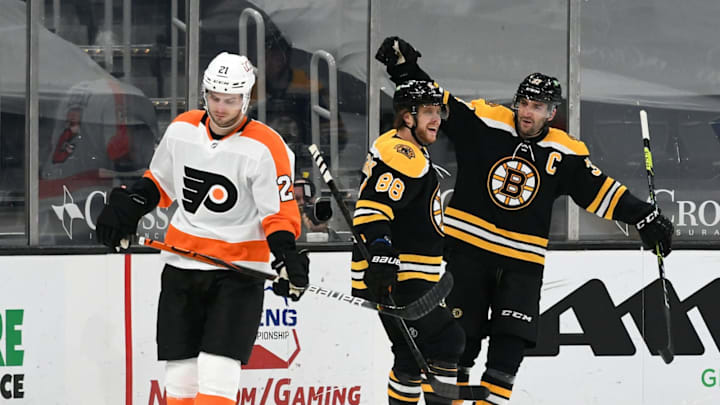 Apr 5, 2021; Boston, Massachusetts, USA; Boston Bruins center Patrice Bergeron (37) celebrates with right wing David Pastrnak (88) after scoring against the Philadelphia Flyers during the second period at the TD Garden. Mandatory Credit: Brian Fluharty-USA TODAY Sports