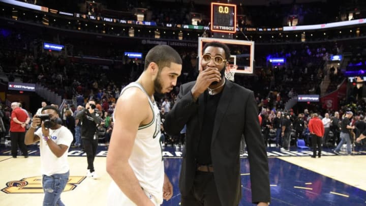 Cleveland Cavaliers center Andre Drummond (right) talks with Boston Celtics forward Jayson Tatum after a game. (Photo by Jason Miller/Getty Images)