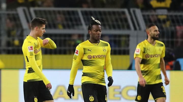 DORTMUND, GERMANY - FEBRUARY 26: Julian Weigl and Michy Batshuayi of Dortmund look dejected after the equalizer goal by Augsburg during the Bundesliga match between Borussia Dortmund and FC Augsburg at Signal Iduna Park on February 26, 2018 in Dortmund, Germany. (Photo by Christof Koepsel/Bongarts/Getty Images)
