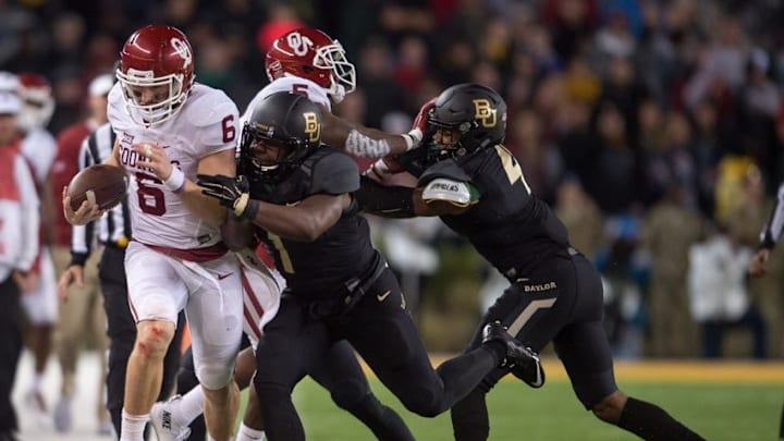 Nov 14, 2015; Waco, TX, USA; Oklahoma Sooners quarterback Baker Mayfield (6) is pushed out of bounds by Baylor Bears linebacker Taylor Young (1) during the second half at McLane Stadium. Mandatory Credit: Jerome Miron-USA TODAY Sports