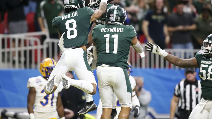 Dec 30, 2021; Atlanta, GA, USA; Michigan State Spartans wide receiver Jayden Reed (1) celebrates after a touchdown catch with wide receiver Jalen Nailor (8) and tight end Connor Heyward (11) against the Pittsburgh Panthers in the first quarter during the 2021 Peach Bowl at Mercedes-Benz Stadium. Mandatory Credit: Brett Davis-USA TODAY Sports