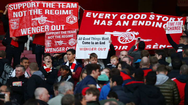 LONDON, ENGLAND - APRIL 30: Arsenal supporters hold protest banners during the Barclays Premier League match between Arsenal and Norwich City at The Emirates Stadium on April 30, 2016 in London, England (Photo by Paul Gilham/Getty Images)