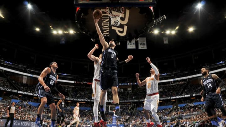 ORLANDO, FL - MARCH 17: Nikola Vucevic #9 of the Orlando Magic shoots the ball against the Atlanta Hawks on March 17, 2019 at Amway Center in Orlando, Florida. NOTE TO USER: User expressly acknowledges and agrees that, by downloading and or using this photograph, User is consenting to the terms and conditions of the Getty Images License Agreement. Mandatory Copyright Notice: Copyright 2019 NBAE (Photo by Fernando Medina/NBAE via Getty Images)