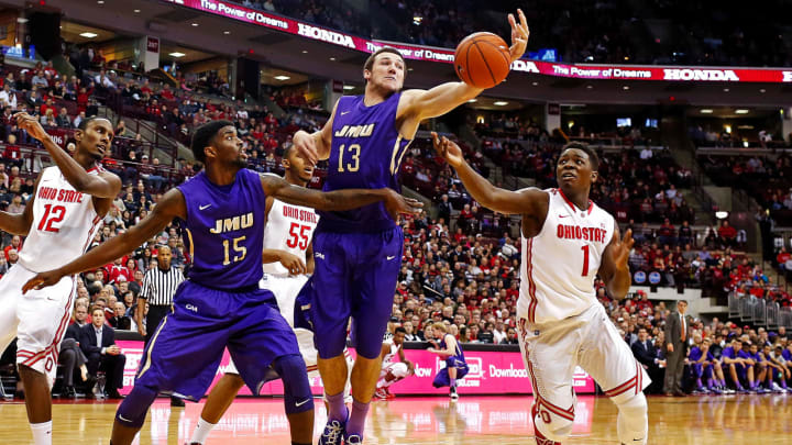 COLUMBUS, OH – NOVEMBER 28: Tom Vodanovich #13 of the James Madison Dukes attempts to control the rebound before Jae’Sean Tate #1 of the Ohio State Buckeyes can get to the ball as Andre Nation #15 of the James Madison Dukes attempts to block out other players during the second half at Value City Arena on November 28, 2014 in Columbus, Ohio. Ohio State defeated James Madison 73-56. (Photo by Kirk Irwin/Getty Images)