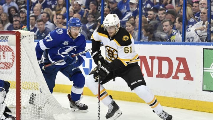 TAMPA, FL - APRIL 30: Boston Bruins left wing Rick Nash (61) circles the net for the wrap-a-round while pursued by Tampa Bay Lightning defender Ryan McDonagh (27) during the third period of an NHL Stanley Cup Eastern Conference Playoffs game between the Boston Bruins and the Tampa Bay Lightning on April 30, 2018, at Amalie Arena in Tampa, FL. (Photo by Roy K. Miller/Icon Sportswire via Getty Images)