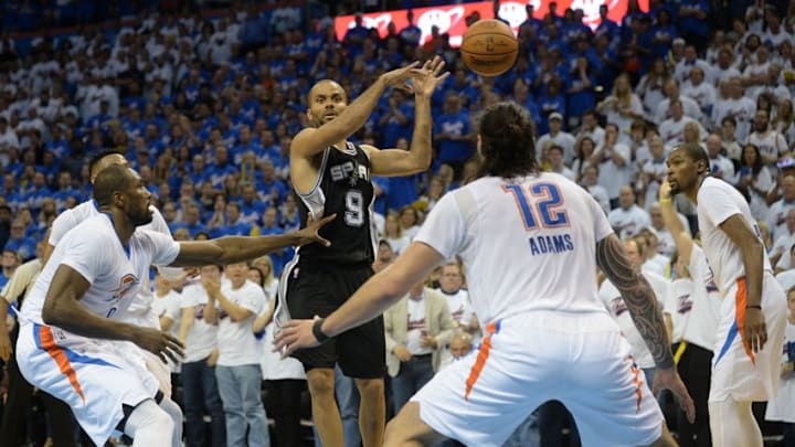 May 6, 2016; Oklahoma City, OK, USA; San Antonio Spurs guard Tony Parker (9) passes the ball while guarded by Oklahoma City Thunder forward Serge Ibaka (9) during the fourth quarter in game three of the second round of the NBA Playoffs at Chesapeake Energy Arena. Mandatory Credit: Mark D. Smith-USA TODAY Sports