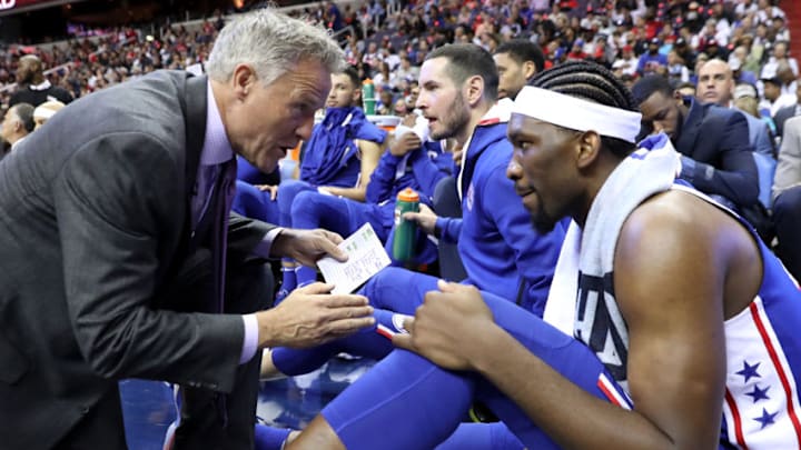 WASHINGTON, DC - OCTOBER 18: Head coach Brett Brown of the Philadelphia 76er talks with Joel Embiid