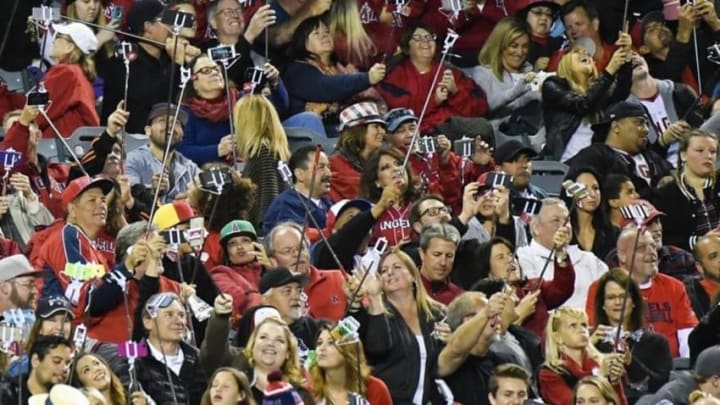 May 6, 2016; Anaheim, CA, USA; The Guinness World Record for selfie sticks used at once is achieved by fans during the fourth inning between the Los Angeles Angels and the Tampa Bay Rays at Angel Stadium of Anaheim. Mandatory Credit: Richard Mackson-USA TODAY Sports