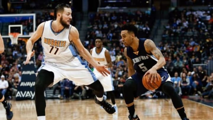 Jan 21, 2016; Denver, CO, USA; Memphis Grizzlies guard Courtney Lee (5) dribbles the ball against Denver Nuggets center Joffrey Lauvergne (77) in the fourth quarter at the Pepsi Center. The Grizzlies defeated the Nuggets 102-101. Mandatory Credit: Isaiah J. Downing-USA TODAY Sports