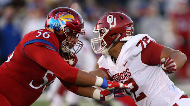 LAWRENCE, KS - NOVEMBER 18: Kansas Jayhawks offensive lineman Zach Hannon (56) blocks Oklahoma Sooners defensive lineman Amani Bledsoe (72) in the third quarter of a Big 12 game between the Oklahoma Sooners and Kansas Jayhawks on November 18, 2017 at Memorial Stadium in Lawrence, KS. (Photo by Scott Winters/Icon Sportswire via Getty Images)