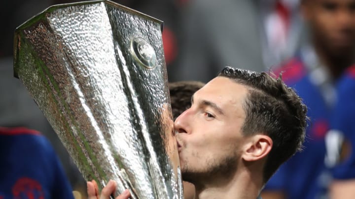 STOCKHOLM, SWEDEN - MAY 24: Matteo Darmian of Manchester United kisses the trophy during the UEFA Europa League Final match between Ajax and Manchester United at Friends Arena on May 24, 2017 in Stockholm, Sweden. (Photo by Ian MacNicol/Getty Images)