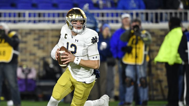 DURHAM, NORTH CAROLINA – NOVEMBER 09: Ian Book #12 of the Notre Dame Fighting Irish rolls out against the Duke Blue Devils during the first quarter of their game at Wallace Wade Stadium on November 09, 2019 in Durham, North Carolina. (Photo by Grant Halverson/Getty Images)