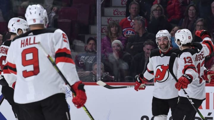 MONTREAL, QC - NOVEMBER 16: Kyle Palmieri #21 of the New Jersey Devils celebrates with teammates after scoring the winning goal on overtime against the Montreal Canadiens in the NHL game at the Bell Centre on November 16, 2019 in Montreal, Quebec, Canada. (Photo by Francois Lacasse/NHLI via Getty Images)