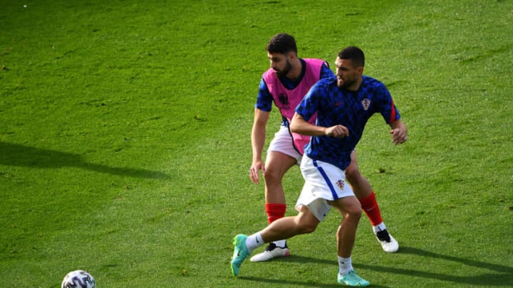 GLASGOW, SCOTLAND - JUNE 22: Josko Gvardiol and Mateo Kovacic of Croatia warm up prior to the UEFA Euro 2020 Championship Group D match between Croatia and Scotland at Hampden Park on June 22, 2021 in Glasgow, Scotland. (Photo by Andy Buchanan - Pool/Getty Images)