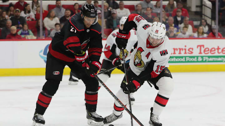 RALEIGH, NC - JANUARY 18: Carolina Hurricanes right wing Nino Niederreiter (21) tries for the puck while eOttawa Senators left wing Zack Smith (15) stick breaks during the 1st period of the Carolina Hurricanes game versus the Ottawa Senators on January 18th, 2019 at PNC Arena in Raleigh, NC. (Photo by Jaylynn Nash/Icon Sportswire via Getty Images)