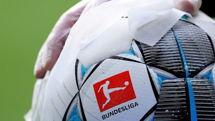 BREMEN, GERMANY - MAY 18: An employee of Werder Bremen disinfects an official match ball ahead of the Bundesliga match between SV Werder Bremen and Bayer 04 Leverkusen at Wohninvest Weserstadion on May 18, 2020 in Bremen, Germany. The Bundesliga and Second Bundesliga is the first professional league to resume the season after the nationwide lockdown due to the ongoing Coronavirus (COVID-19) pandemic. All matches until the end of the season will be played behind closed doors. (Photo by Stuart Franklin/Getty Images)