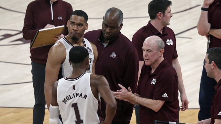 Mar 2, 2022; Starkville, Mississippi, USA; Mississippi State Bulldogs head coach Ben Howland (right) talks with forward Garrison Brooks (10) and guard Iverson Molinar (1) during a timeout during the second half at Humphrey Coliseum. Mandatory Credit: Petre Thomas-USA TODAY Sports