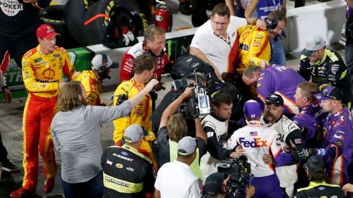 MARTINSVILLE, VIRGINIA - OCTOBER 27: Denny Hamlin, driver of the #11 FedEx Freight Toyota, Joey Logano, driver of the #22 Shell Pennzoil Ford, and their crews have an altercation on pit lane following the Monster Energy NASCAR Cup Series First Data 500 at Martinsville Speedway on October 27, 2019 in Martinsville, Virginia. (Photo by Brian Lawdermilk/Getty Images)