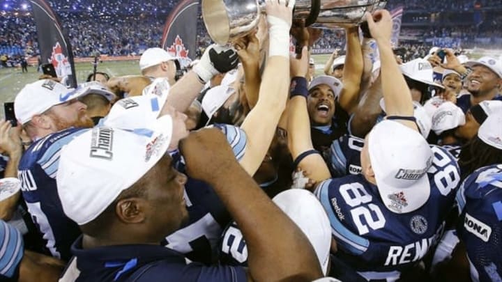 November 25, 2012; Toronto, ON, Canada; Toronto Argonauts players hoist the Grey Cup after the game against the Calgary Stampeders at the Rogers Centre. Toronto defeated Calgary Stampeders 35-22. Mandatory Credit: John E. Sokolowski-USA TODAY Sports