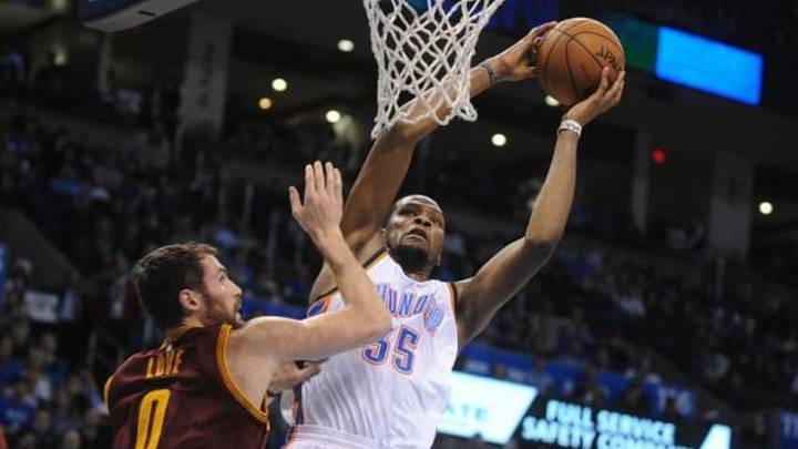 Dec 11, 2014; Oklahoma City, OK, USA; Oklahoma City Thunder forward Kevin Durant (35) dunks the ball against Cleveland Cavaliers forward Kevin Love (0) during the fourth quarter at Chesapeake Energy Arena. Mandatory Credit: Mark D. Smith-USA TODAY Sports