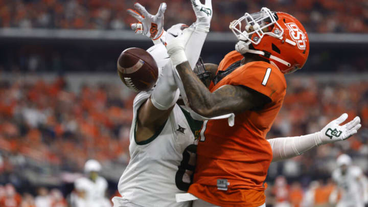 ARLINGTON, TX - DECEMBER 4: Tay Martin #1 of the Oklahoma State Cowboys has a pass in the end zone knocked away by Jalen Pitre #8 of the Baylor Bears in the first half of the Big 12 Football Championship at AT&T Stadium on December 4, 2021 in Arlington, Texas. (Photo by Ron Jenkins/Getty Images)