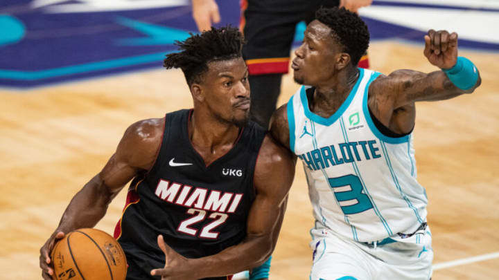 CHARLOTTE, NORTH CAROLINA - MAY 02: Jimmy Butler #22 of the Miami Heat drives to the basket while guarded by Terry Rozier #3 of the Charlotte Hornets in the second quarter at Spectrum Center on May 02, 2021 in Charlotte, North Carolina. NOTE TO USER: User expressly acknowledges and agrees that, by downloading and or using this photograph, User is consenting to the terms and conditions of the Getty Images License Agreement. (Photo by Jacob Kupferman/Getty Images)