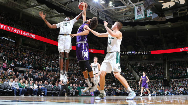 EAST LANSING, MI – JANUARY 02: Gabe Brown #13 of the Michigan State Spartans grabs a rebound against Barret Benson #25 of the Northwestern Wildcats in the second half at Breslin Center on January 2, 2019 in East Lansing, Michigan. (Photo by Rey Del Rio/Getty Images)