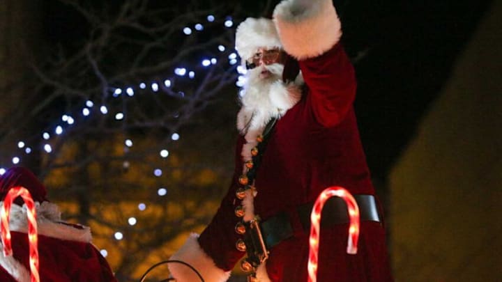 Santa Clause waves at children who gathered for Greater Lafayette's annual Christmas Parade, "A Very Merry Main Street," Saturday, Dec. 3, 2022, in Lafayette, Ind.Np1 1294