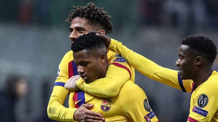 Barcelona´s Guinea-Bissau forward Ansu Fati (L) celebrates with Barcelona's French defender Jean-Clair Todibo (Rear) after scoring during the UEFA Champions League Group F football match Inter Milan vs Barcelona on December 10, 2019 at the San Siro stadium in Milan. (Photo by Isabella BONOTTO / AFP) (Photo by ISABELLA BONOTTO/AFP via Getty Images)