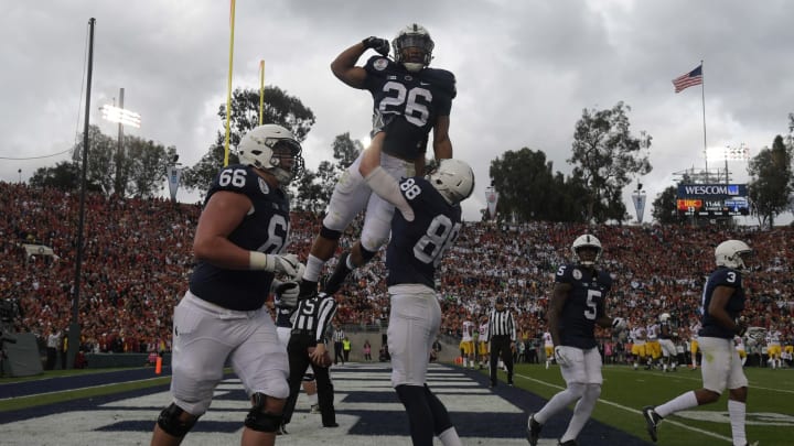 Jan 2, 2017; Pasadena, CA, USA; Penn State Nittany Lions running back Saquon Barkley (26) celebrates with tight end Mike Gesicki (88) after scoring on a 24-yard touchdown run in the second quarter against the USC Trojans during the 103rd Rose Bowl at Rose Bowl. USC defeated Penn State 52-49 in the highest scoring game in Rose Bowl history. Mandatory Credit: Kirby Lee-USA TODAY Sports