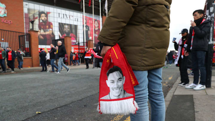 LIVERPOOL, ENGLAND - MARCH 07: A Liverpool supporter arrives outside Anfield prior to the Premier League match between Liverpool FC and AFC Bournemouth at Anfield on March 07, 2020 in Liverpool, United Kingdom. (Photo by Alex Livesey - Danehouse/Getty Images )