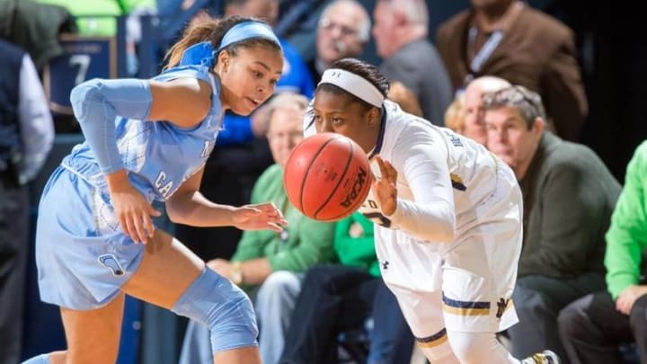 Jan 10, 2016; South Bend, IN, USA; Notre Dame Fighting Irish guard Arike Ogunbowale (2) dribbles past North Carolina Tar Heels guard Stephanie Watts (5) in the third quarter at the Purcell Pavilion. Notre Dame won 88-54. Mandatory Credit: Matt Cashore-USA TODAY Sports