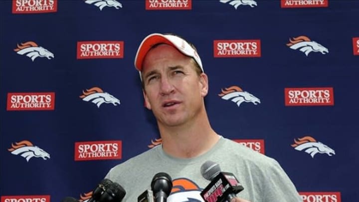 May 20, 2013; Englewood, CO, USA; Denver Broncos quarterback Peyton Manning (18) speaks to the media following organized team activities at the Broncos training facility. Mandatory Credit: Ron Chenoy-USA TODAY Sports