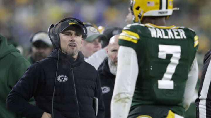 Jan 8, 2023; Green Bay, Wisconsin, USA; Green Bay Packers head coach Matt LaFleur approaches linebacker Quay Walker (7) after he was ejected from the game against the Detroit Lions during their football game at Lambeau Field. Mandatory Credit: Dan Powers/Appleton Post-Crescent via USA TODAY NETWORK