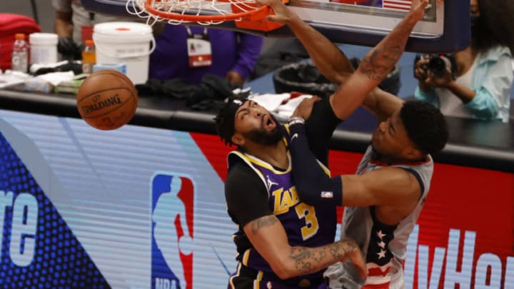 Apr 28, 2021; Washington, District of Columbia, USA; Washington Wizards forward Rui Hachimura (8) dunks the ball over Los Angeles Lakers forward Anthony Davis (3) in the third quarter at Capital One Arena. Mandatory Credit: Geoff Burke-USA TODAY Sports