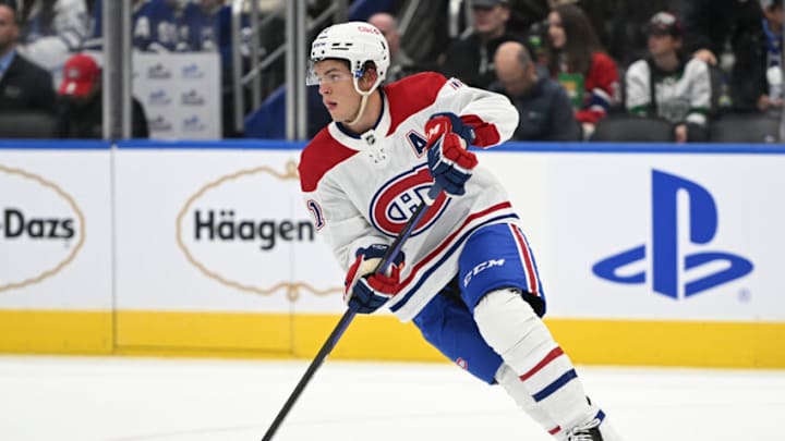 Sep 28, 2022; Toronto, Ontario, CAN; Montreal Canadiens forward Jake Evans (71) skates with the puck against the Toronto Maple Leafs in the first period at Scotiabank Arena. Mandatory Credit: Dan Hamilton-USA TODAY Sports Sep 28, 2022; Toronto, Ontario, CAN; Montreal Canadiens forward Jake Evans (71) skates with the puck against the Toronto Maple Leafs in the first period at Scotiabank Arena. Mandatory Credit: Dan Hamilton-USA TODAY Sports