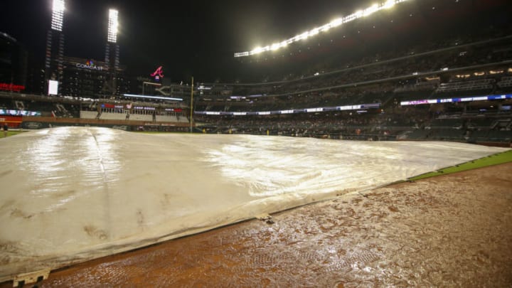 Aug 15, 2022; Atlanta, Georgia, USA; A tarp on the field at Truist Park during a rain delay in the second inning of a game between the Atlanta Braves and New York Mets. Mandatory Credit: Brett Davis-USA TODAY Sports