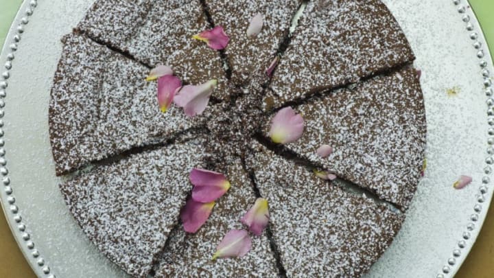 IRELAND - JUNE 05: Home-baked chocolate cake with rose petals on sale at farmers' market, County Clare, West of Ireland (Photo by Tim Graham/Getty Images)