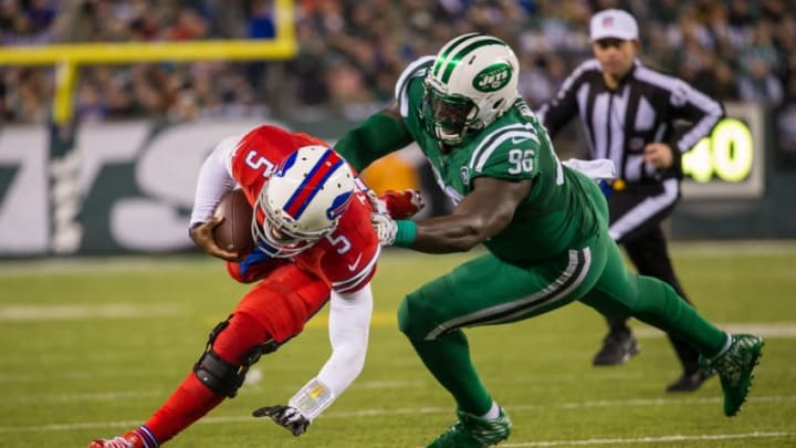 Nov 12, 2015; East Rutherford, NJ, USA;New York Jets defensive end Muhammad Wilkerson (96) tackles Buffalo Bills quarterback Tyrod Taylor (5) in the second half at MetLife Stadium. The Bills defeated the Jets 22-17 Mandatory Credit: William Hauser-USA TODAY Sports