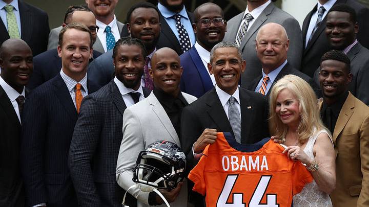 WASHINGTON, DC - JUNE 06: U.S. President Barack Obama holds up a Denver Broncos jersey presented to him as a gift by Annabel Bowlen (R), wife of Broncos majority owner Pat Bowlen, while welcoming the National Football League Super Bowl champion Denver Broncos to the White House Rose Garden on June 6, 2016 in Washington, DC. The Broncos defeated the Carolina Panthers 24-10 in Super Bowl 50. (Photo by Win McNamee/Getty Images)