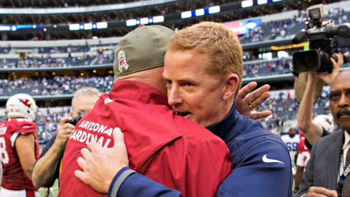ARLINGTON, TX - NOVEMBER 2: Head Coach Jason Garrett of the Dallas Cowboys and Head Coach Bruce Arians of the Arizona Cardinals hug after the game at AT