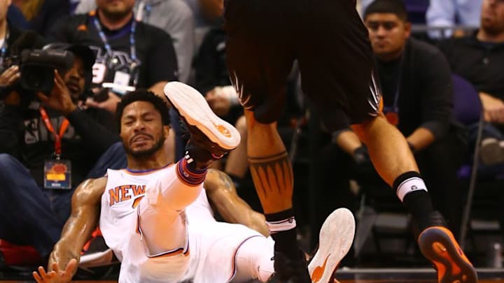 Dec 13, 2016; Phoenix, AZ, USA; New York Knicks guard Derrick Rose (25) reacts as he lands on his back against the Phoenix Suns in the first quarter at Talking Stick Resort Arena. The Suns defeated the Knicks 113-111 in overtime. Mandatory Credit: Mark J. Rebilas-USA TODAY Sports